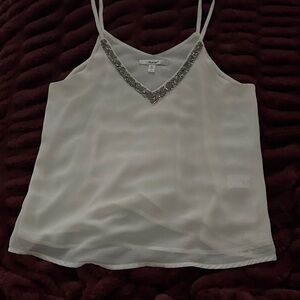 White Sheer lined Beaded V-Neck blouse.